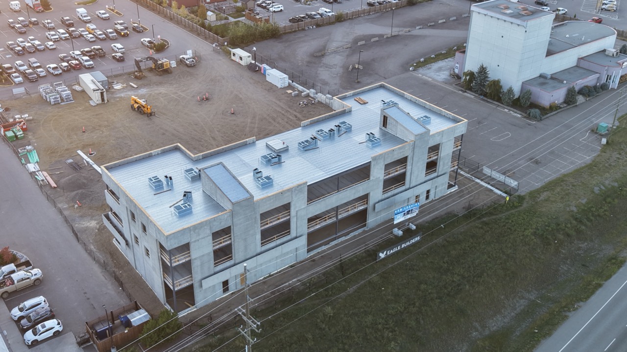 Angled aerial view of the RECPLACE structure and roof beside Highway 16
